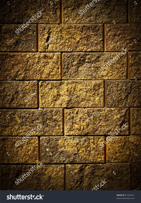 Dark Gold Brick Wall Background Or Texture Stock Photo
