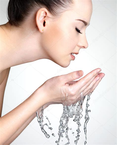 Woman Washing Her Face With Water Stock Photo By ©valuavitaly 9001358