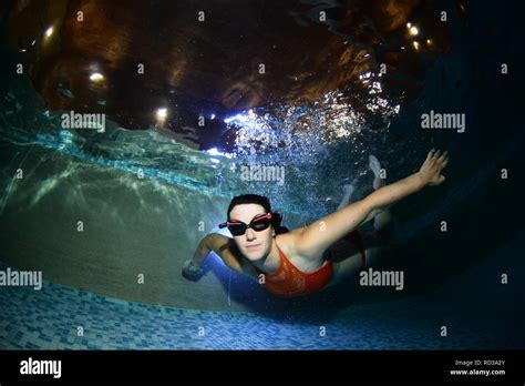 Women Swimming Underwater In A Swimming Pool Stock Photo Alamy