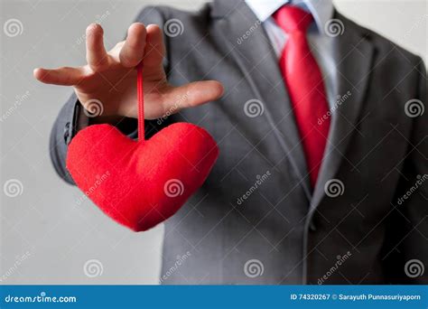Businessman Winning And Controling Customer S Heart Concept Stock Image