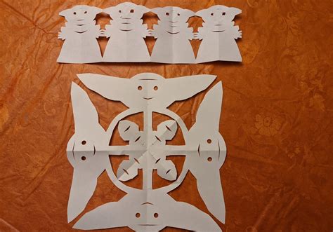 How To Amaze Your Kids With Baby Yoda Snowflakes And Paper Doll Chains