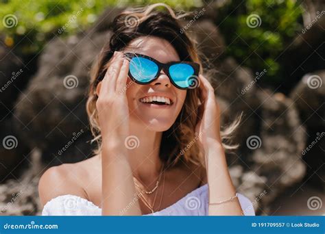 Sensual Female Model With Tanned Skin Looking At Sky And Laughing Positive Caucasian Girl In