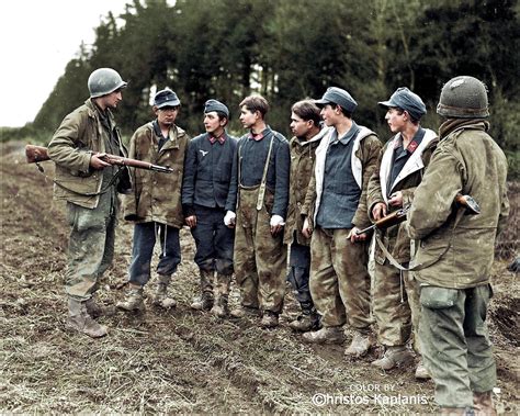 Two Gis Of The 4th Infantry Division Guard A Group Of Teenage German