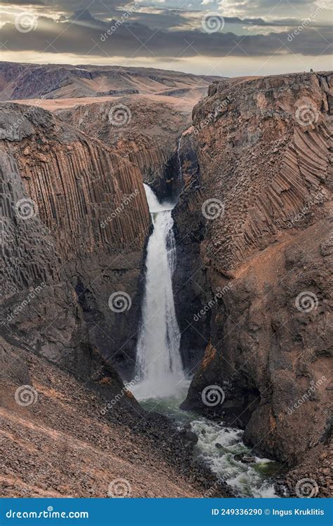 Idyllic Litlanesfoss Waterfall Amidst Basalt Columns And Stream Against