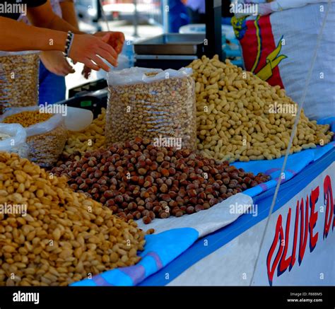 Selling Nuts Almonds Peanuts Walnuts Seeds Etc For Sale On A Small Cart On The Street