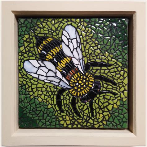 A Glass Mosaic With A Bee On It