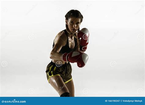 Fit Caucasian Woman In Sportswear Boxing On White Studio Background