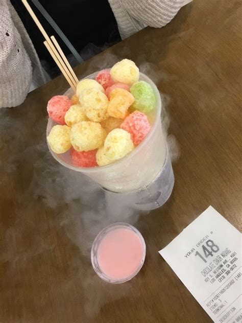 The colorful dessert is made up of liquid nitrogen coated ice cream cereal ball, through which smoke is breathed out from mouth and nose on eating. Chocolate Chair photos | Food drinks dessert, Trendy food ...