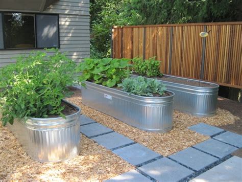 Making an instant seasonal water garden—meaning no plumbing required—merely requires a watertight vessel, water, and some floating plants to shade the water surface. Landscape Galvanzied Feeding Trough | yard | Pinterest