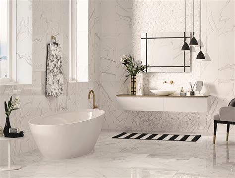 However, it also works well in luxury bathrooms where a touch of gold undertones creates a royal space. Precious Calacatta Gloss Ceramic Wall Tile - EMC Tiles