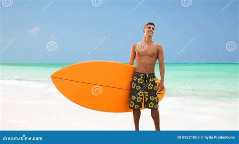 Smiling Young Man With Surfboard On Beach Stock Image Image Of