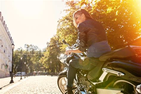 Biker Girl In A Leather Jacket Riding A Motorcycle Stock Photo Image