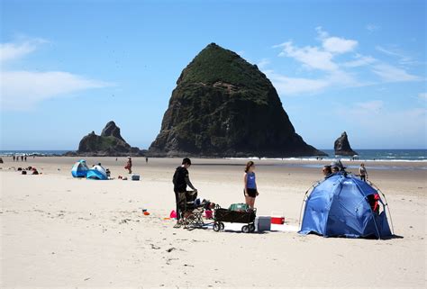 Crowds Return To Cannon Beach As Oregon Coast Town Begins To Reopen