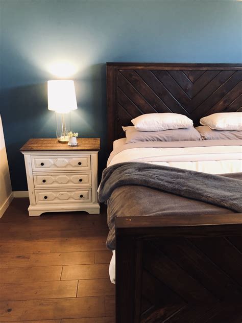 Were it not for the vivid white wall for contrast coupled with the bold crimson linens on the bed, the ebony bed frame, door, and night stand details might otherwise be. Stained dark brown bed frame. With tribal or chevron ...