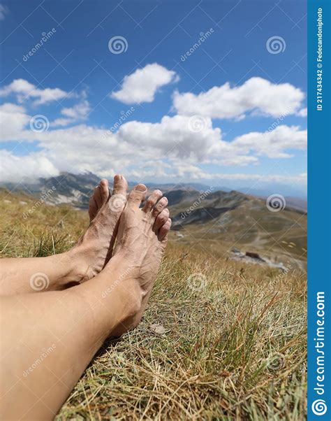Bare Feet Of The Hiker While Resting After Hiking In The Mountains
