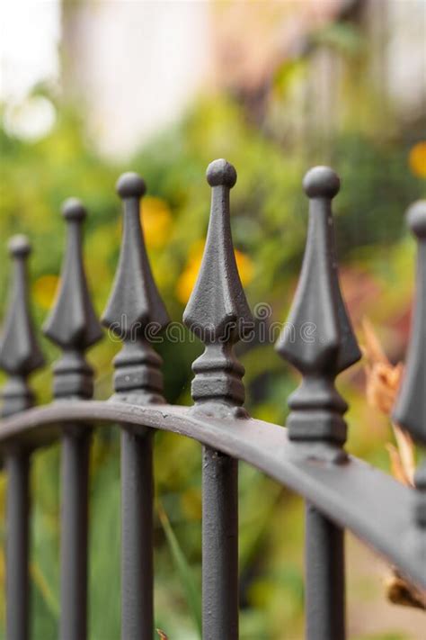 Wrought Pointed Metal Fence Black Spikes With Linear Perspective Stock