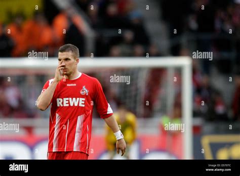 Colognes Lukas Podolski Touches His Nose During German Bundesliga