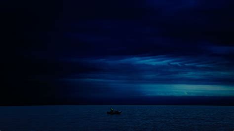 3840x2160 Dark Evening Blue Cloudy Alone Boat In Ocean 4k Wallpaper Hd