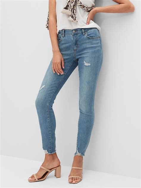 Mid Rise Soft Touch Medium Wash Destructed Skinny Jean Banana
