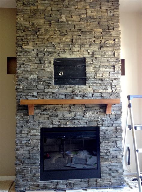 I placed all of the stones across the opening of the fireplace, then pushed. Hirondelle Rustique: DIY Stacked Stone Fireplace (First ...