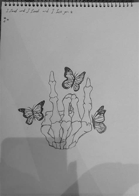 A Drawing Of Three Butterflies Flying In The Air On Top Of A Piece Of Paper