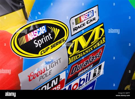 Right Side Of A Nascar Racecar Showing Sponsor Decals Placed In Rows