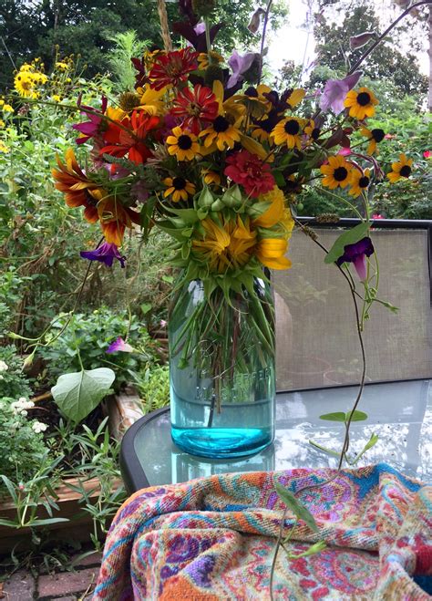 Clear glass vase into a colorful one decorate a glass using gift wrap, leftover wallpaper, maps, scrapbook paper, and show flowers in style! Summer Yard Flowers. | Flowers, Glass vase, Vase