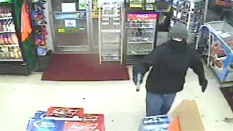 Suspect Caught On Camera Robbing Norman Store At Gunpoint