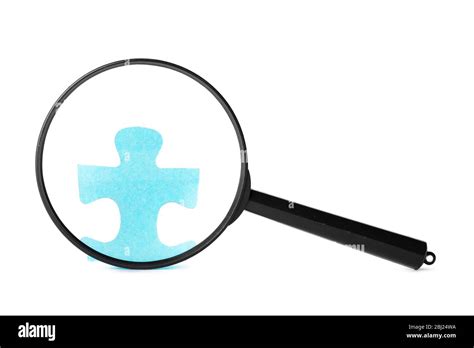 Magnifying Glass Searching For Missing Puzzle Pieces Stock Photo Alamy