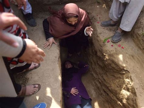 Women Break With Tradition In Afghanistan To Help Bury Completely