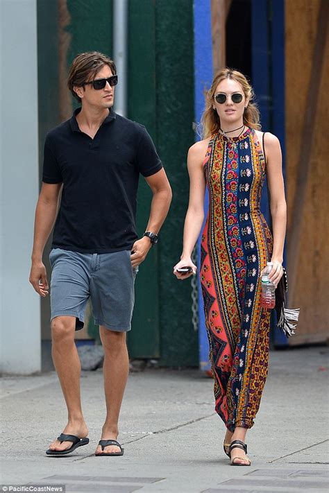 candice swanepoel showcases her supermodel figure in a bold patterned maxi dress as she enjoys