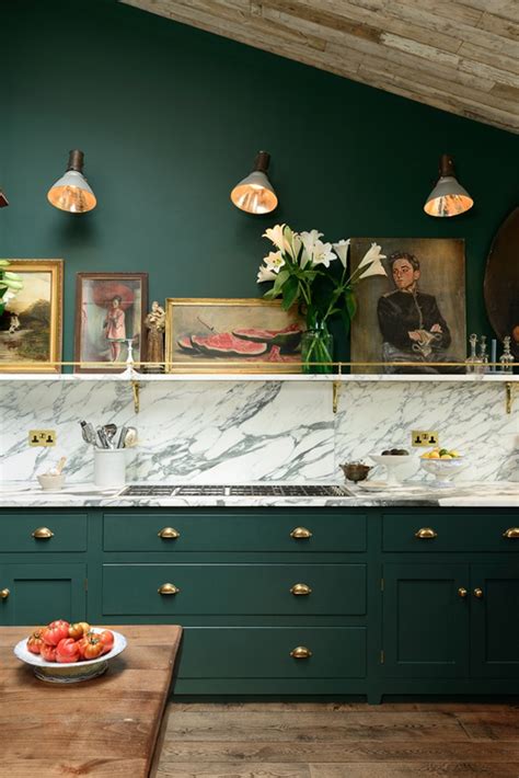 White marble slabs are one of the best options for flooring material due to its beautiful and pure look. Victorian Green, Marble And Brass Kitchen Design - DigsDigs