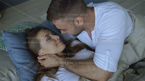 Young Beautiful And Loving Couple Wake Up At The Morning Attractive Man Kiss And Hug His Wife