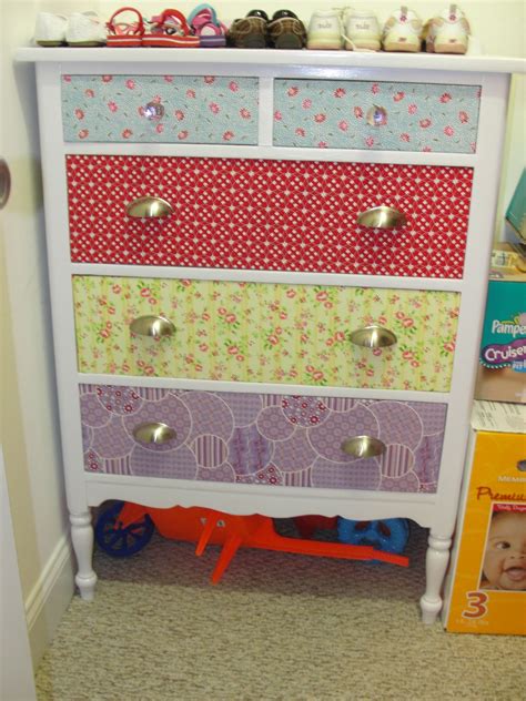 Brush fabric decoupage medium on one dresser surface with a sponge applicator. refinished dresser - painted body white and covered the ...