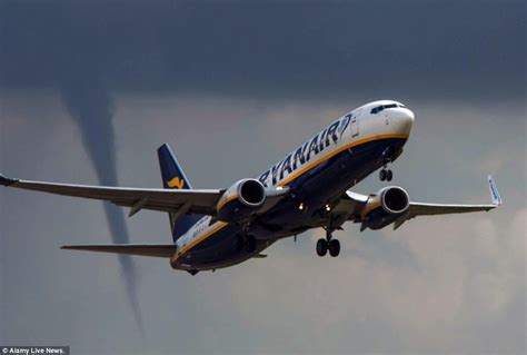 A suspected tornado has damaged homes, torn down garden walls, and sent dustbins flying hundreds of metres through the air in east london. 'We may be about to experience some turbulence ...