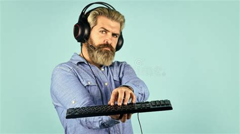 Gaming Addiction Man Bearded Hipster Gamer Headphones And Keyboard