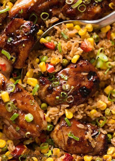 An entire baking tray of chicken, rice, and vegetables, all baked together. Baked Chinese Chicken and Rice - Spend With Pennies