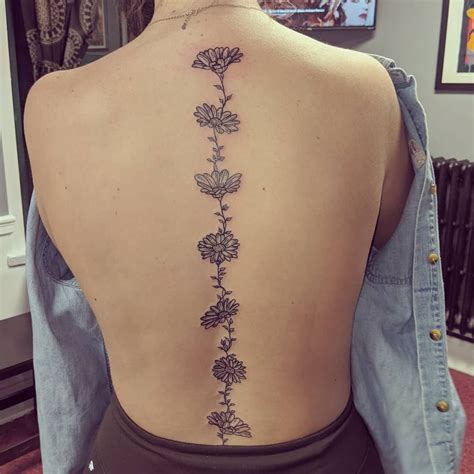 discover 86 flowers down spine tattoo in cdgdbentre