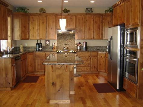 Rustic cabinet doors and cabinets are typically made using knotty material such as knotty alder, knotty hickory, pecan or knotty cherry with cabinet doors in cope and stick designs that are very simple with little edge and panel detail. small spaces | Kitchen plans, Alder cabinets, Knotty alder ...
