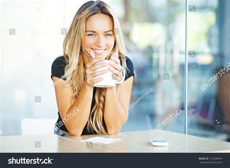 Woman Drinking Coffee In The Morning At Restaurant Soft Focus On Eyes