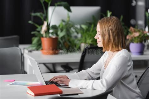 Advertising Manager Works With The Marketing Graphics On Laptop Stock