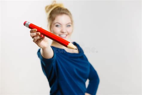 Happy Woman Holding Giving Big Pencil Stock Photo Image Of Giving