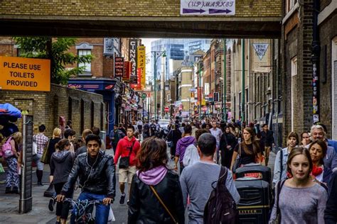People In Brick Lane Street In East London Editorial Stock Photo
