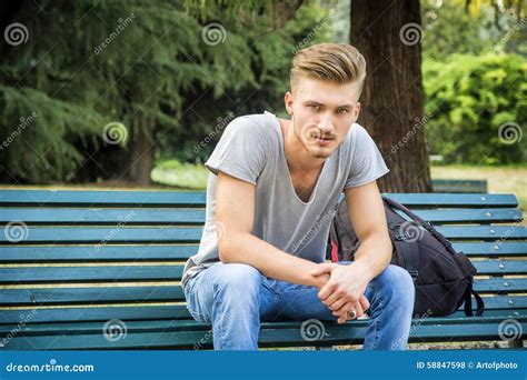 Handsome Blond Young Man Sitting On Park Bench Stock Photo Image Of