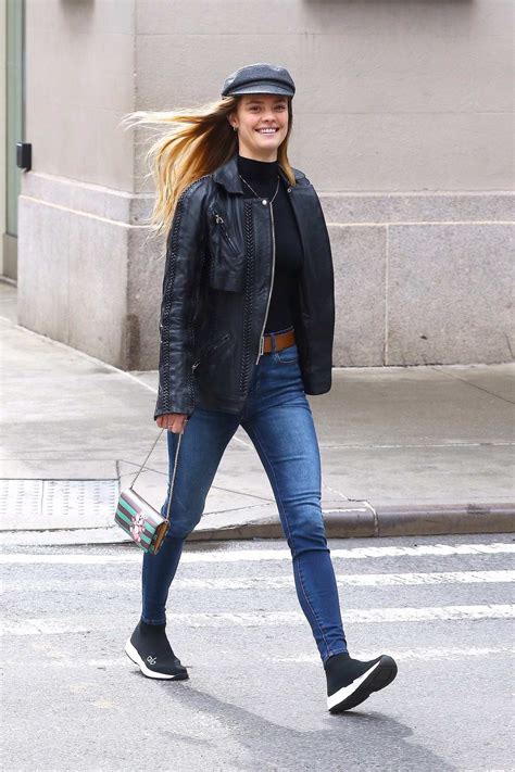 Nina Agdal Keeps It Trendy With A Hat Black Leather Jacket And Blue