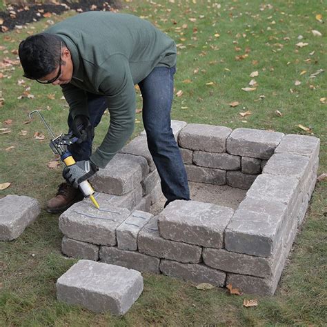 Laying Third Row Of Retaining Wall Blocks Fire Pit Custom Fire Pit