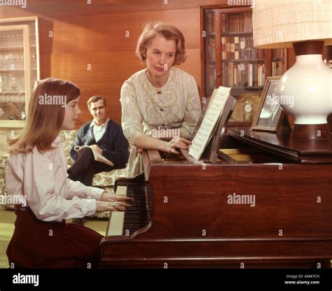 1970 1970s Mother Turning Page Music Girl Daughter Plays Piano Living