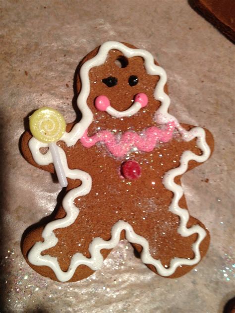 A Cookie Shaped Like A Ginger Holding A Lollipop