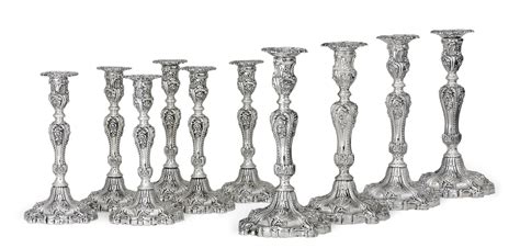 A Set Of Ten William Iv And Victorian Silver Candlesticks