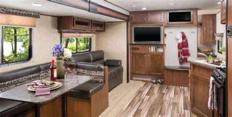 The queen bed in front flips up to provide sofa space during the day, with end tables for extra storage and convenience. Top 5 Best Travel Trailers Under 3,000 Pounds | Outdoor Fact
